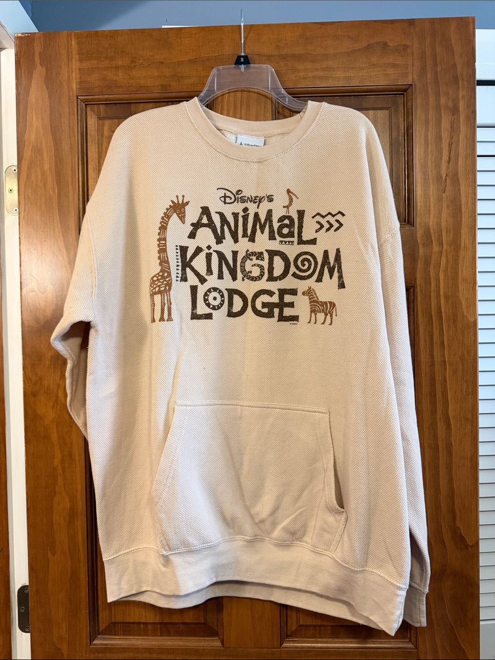 Disney Cream Crewneck Sweatshirt with Brown Animal Kingdom Lodge Graphic